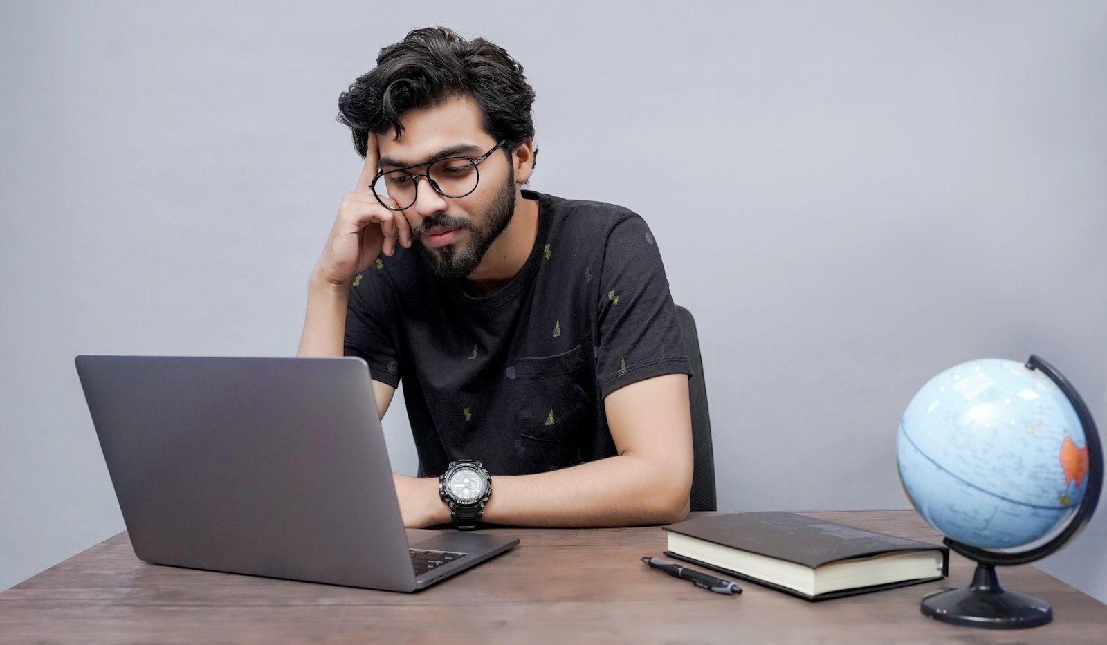 Indian student learning on laptop